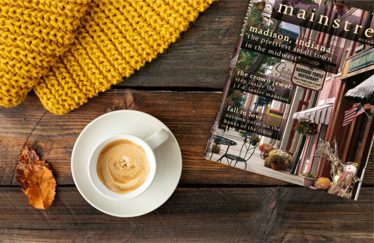 Mainstreet Magazine mockup in an autumn setting with a blanket and coffee